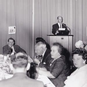 Principal Merv Hall addresses anniversary dinner