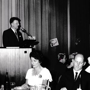 Principal Merv Hall listens at 150th Dinner